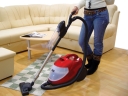 Person vacuum cleaning their room. Photograph by Muris Kuloglija Kula