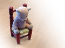 Teddy bear on chair. Photograph by brainloc