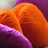 Vignette: Orange and purple cushions. Photograph by Yee ST