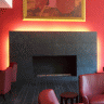 Vignette: Living room with fireplace. Photograph by Enrico Corno
