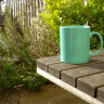 Vignette: Mug on garden table. Photograph by Graham Soult