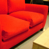Vignette: Red sofa and coffee table. Photograph by Lotus Head